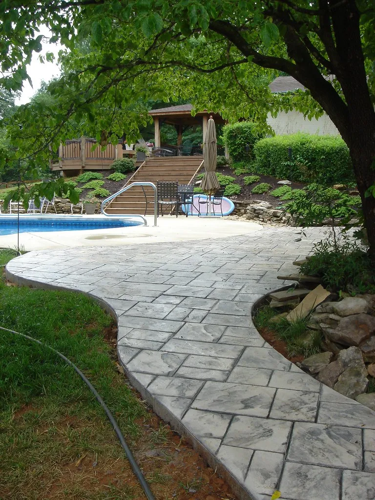 stamped concrete walkway to swimming pool