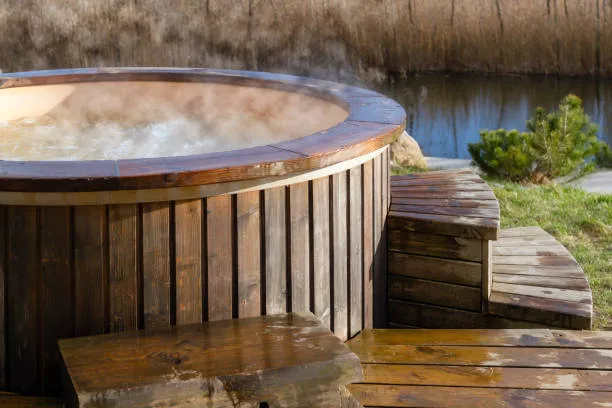 steaming hot wood covered Jacuzzi GTLAD