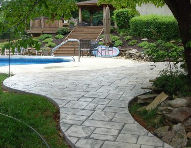 stamped concrete walkway to swimming pool